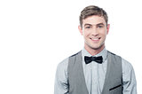 Smart young smiling man with bowtie