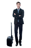 Young business man with trolley bag