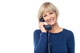 Woman talking on the landline phone