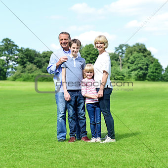 Smiling parents with their kids in the park