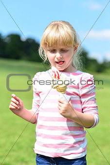 Cute little girl eating ice cream