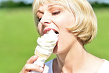 Middle aged woman eating an ice cream
