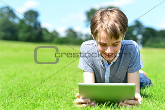 Young boy playing on tablet pc