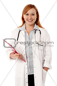 Young smiling doctor holding clipboard