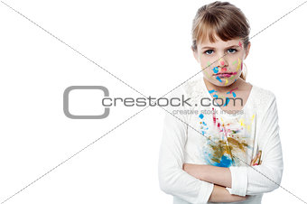 Serious girl with paint on face
