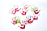 Multicoloured painted hand prints isolated on white