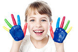 Smiling girl with painted hands