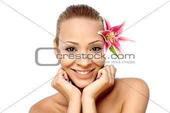 Smiling girl with pink flower