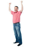 Mature gentleman with raised arms