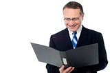 Smart businessman holding a open file
