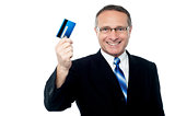 Business executive holding credit card