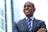 Smiling black businessman at outdoors