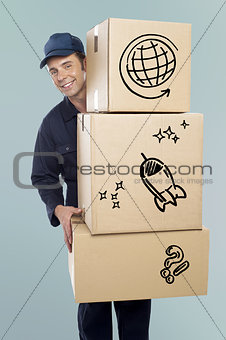 Delivery man carrying a cardboard boxes