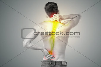 Young man has pain in his back