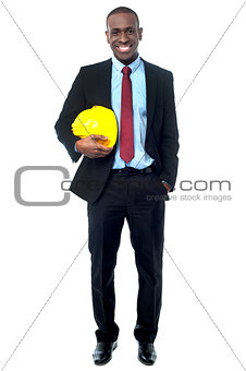 Construction engineer holding hard hat