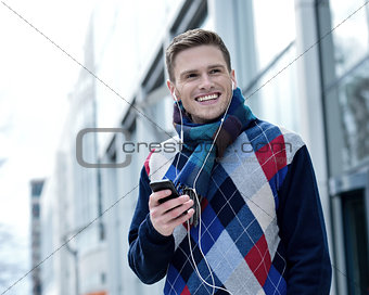 Guy enjoying music on street
