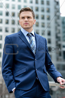 Handsome businessman posing outdoors