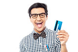 Laughing guy holding credit card