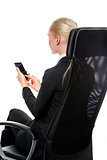 businesswoman seated on a chair with mobile phone