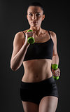 Fitness woman working out with green dumbbell. Running model