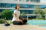 Business Woman Doing Yoga Lotus Position Outside Office Building