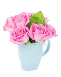 Small pink rose flowers bouquet in tea cup