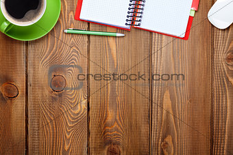 Office desk table with supplies and coffee cup