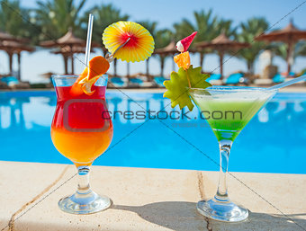 Cocktail drinks by a swimming pool
