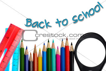 Back to school - coloring crayons and ruler isolated on white background