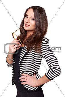 Businesswoman with glasses in her lips looking to the camera isolated