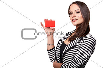 Close-up portrait of young smiling business woman holding credit card isolated on white background