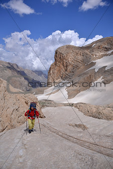 Woman climbs a  mountain