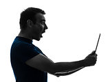 man holding digital tablet  surprised silhouette