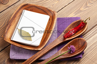 Wood kitchen utensils over wooden table
