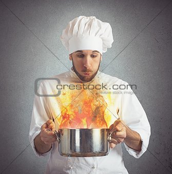 Chef blowing burnt food