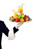 Waiter serving fruits and orange juice