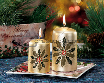 Closeup of colored Christmas candles on colored background