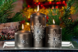 Closeup of colored Christmas candles on colored background