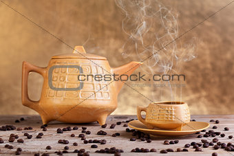 Steaming coffee on wooden table