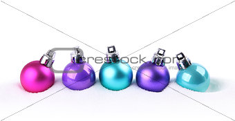 Colorful Christmas balls in snow