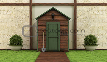 Wooden shed in a classic garden