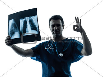 doctor surgeon radiologist gesturing okay examining lung torso