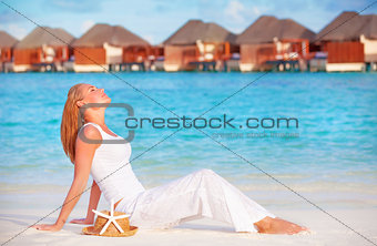 Girl taking sunbath on the beach