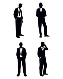 Four businessman silhouettes