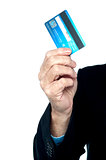 Cropped image of a man showing credit card