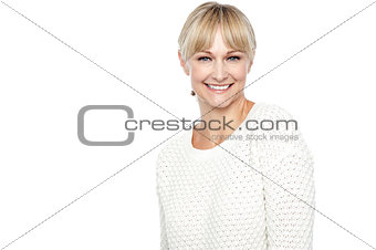 Smiling middle aged woman in trendy wear
