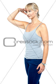 Gorgeous woman trying to focus on a distant object