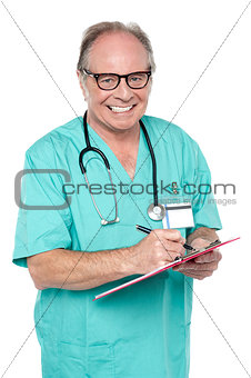 Cheerful doctor gathering information from patient