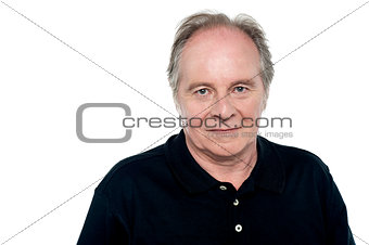 Relaxed senior caucasian male looking at you