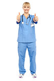 Cheerful lady doctor showing double thumbs up
